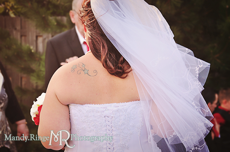 Candid shot of the bride's veil blowing to the side showing her shoulder tattoo // Wedding Photography // Lincoln Inn Banquets - Batavia, IL // by Mandy Ringe Photography 