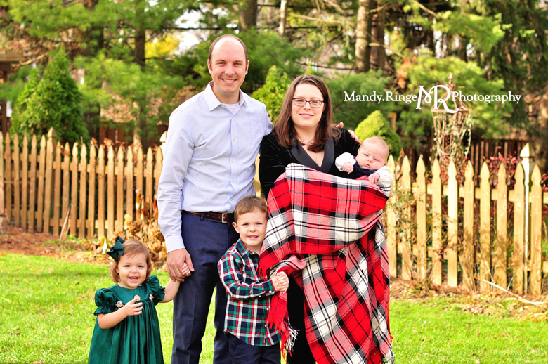 Family Christmas Portraits // Outdoors, plaid blanket, winter // by Mandy Ringe Photography