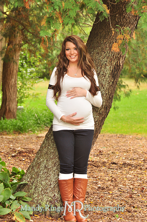 Woman standing against a tree with hands holding her belly // Maternity portraits // Hurley Gardens - Wheaton, IL // by Mandy Ringe Photography