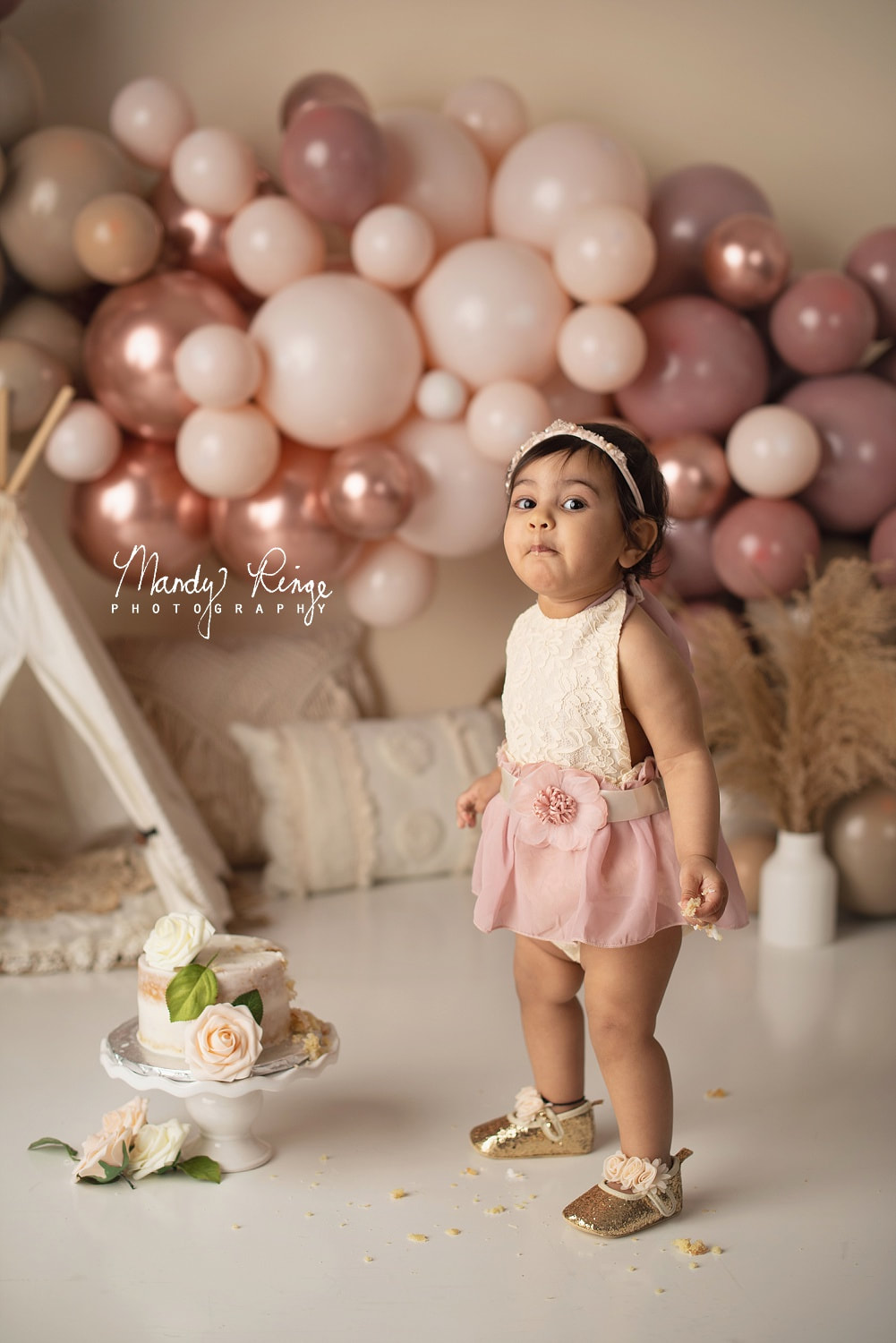 First birthday milestone session, cake smash // teepee, boho balloons, neutral, dusty pink // Mandy Ringe Photography // Sycamore, IL Studio Photographer