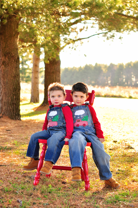 Christmas portrait mini session // sunny day, open field, pine trees, red chair // St Charles, IL // by Mandy Ringe Photography