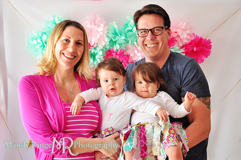 Twin girl's first birthday, family portraits // White chair, fabric pennants, rag banner, rag skirt, pink, teal, fuchsia, yellow, tissue paper pom poms // by Mandy Ringe Photography