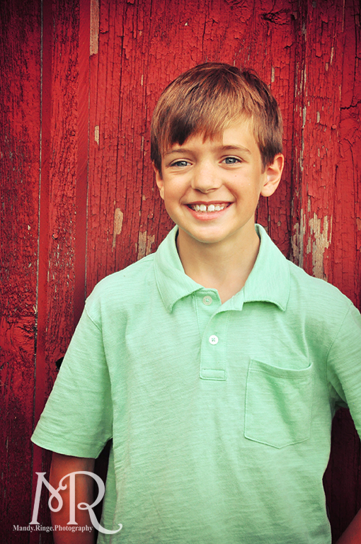 Boy in front of a red barn / / Leroy Oaks // by Mandy Ringe Photography