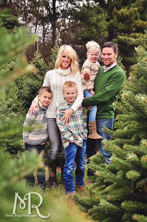 Family Christmas Portrait // Christmas Tree Farm // simple Christmas photo idea, standing among pine trees // by Mandy Ringe Photography