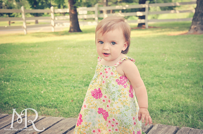 Baby girl in front of a white fence // Leroy Oaks // by Mandy Ringe Photography