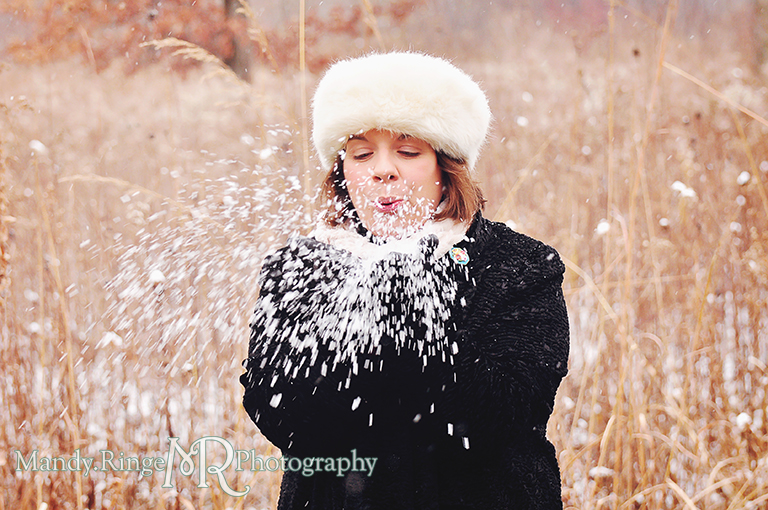 Outdoor winter photo of a woman blowing snow from her hands // Prairie background,  rustic setting, // Ferson Creek Fen - St Charles, IL // by Mandy Ringe Photography