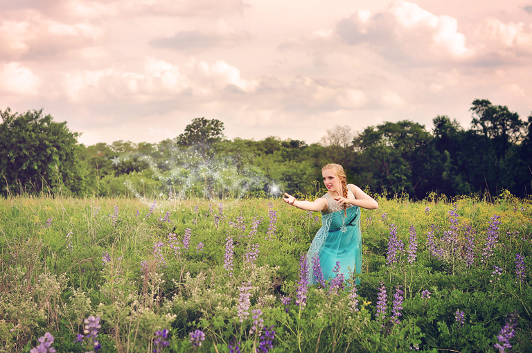 Elsa impersonator, cosplay, dressup, costume // Standing in a wildflower field. Magical snow overlays // by Mandy Ringe Photography