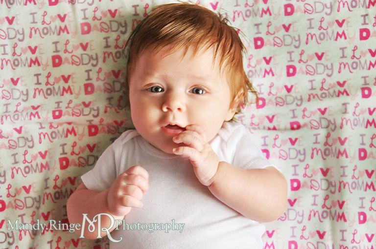 Monthly baby photos // Fabric background, white onesie // by Mandy Ringe Photography