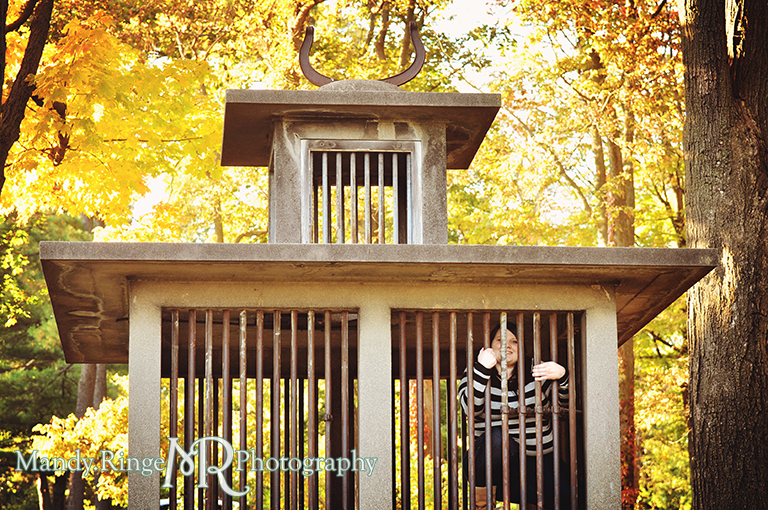 Teen girl sitting inside the monkey cage // Senior Photos // Fabyan Forest Preserve - Batavia, IL // by Mandy Ringe Photography