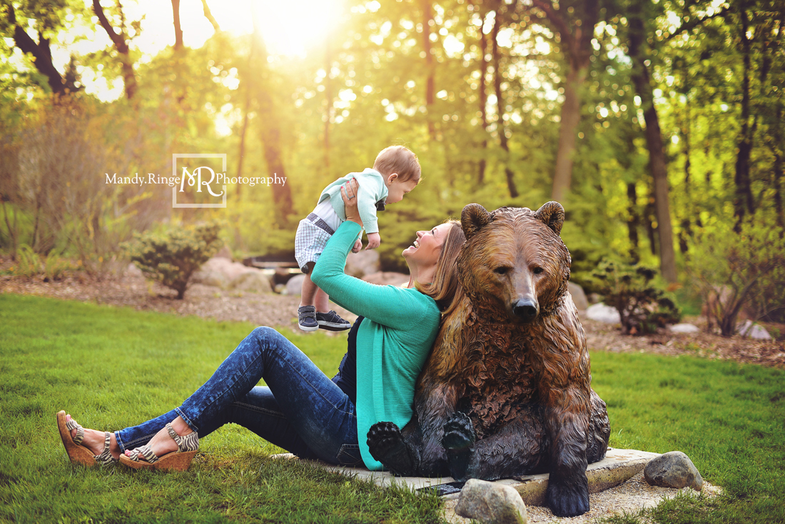 Spring family portraits // family of three, backlighting, bear statue, teal and navy // Mount St. Mary Park - St. Charles, IL // by Mandy Ringe Photography