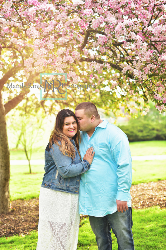 Spring family portraits // cherry blossom tree, pink and blue, outdoors, family of three, flowers // Mount St. Mary Park - St Charles, IL // by Mandy Ringe Photography