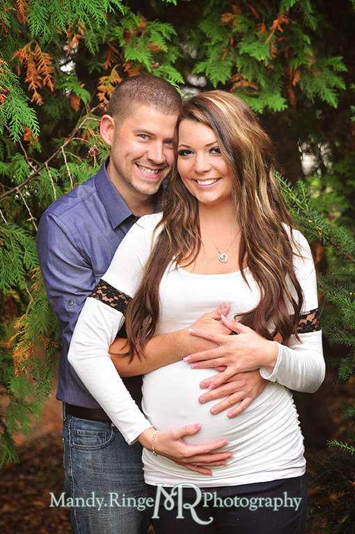 Man and woman posing with hands on her belly // Maternity portraits // Hurley Gardens - Wheaton, IL // by Mandy Ringe Photography