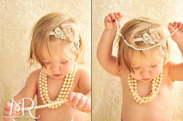 12 month old portrait with pearls and ivory flower headband // by Mandy Ringe Photography