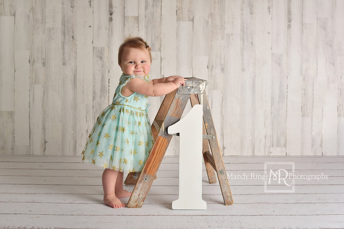 Baby girl first birthday portraits // Teal star dress, one year old, ladder, shabby white wood backdrop, simple, classic // by Mandy Ringe Photography // St. Charles, IL Photographer