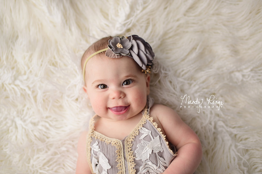 6 month milestone session // baby girl, white fur backdrop, Cora & Violet Anwen outfit // Sycamore, IL studio photographer // Mandy Ringe Photography