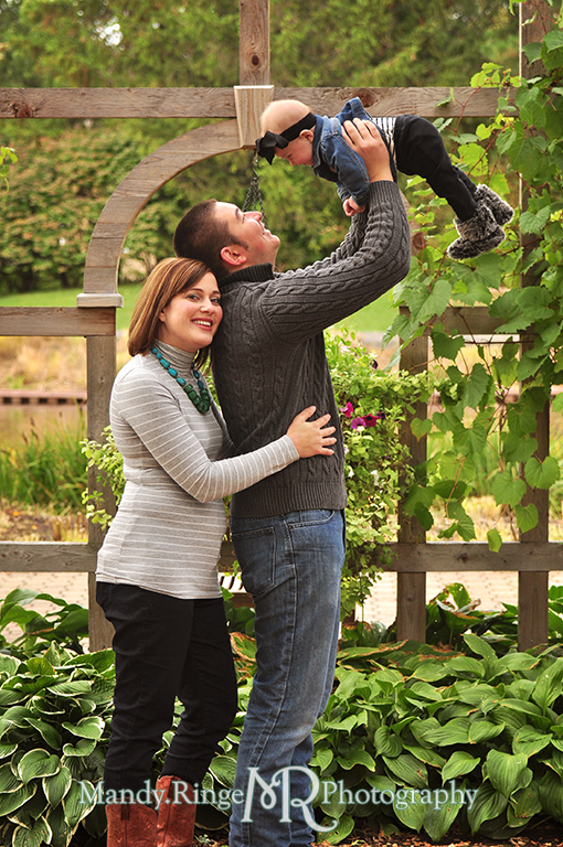 6 month old baby girl portraits // Dad holding her up while mom hugs him from behind // Cantigny Gardens - Wheaton, IL // by Mandy Ringe Photography