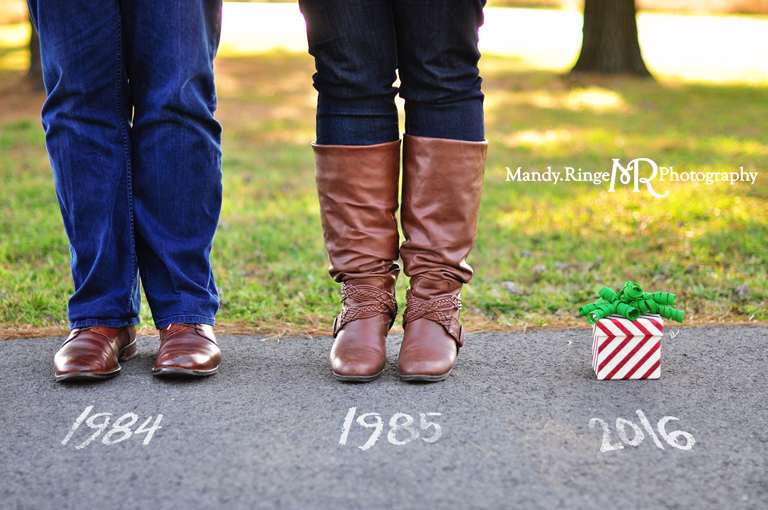 Christmas pregnancy announcement mini session // close up of feet with dad, mom, and a present, chalk years on pavement // St Charles, IL // by Mandy Ringe Photography