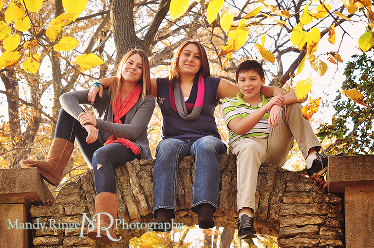Autumn family portraits - Sitting on a stone arch // Fabyan Forest Preserve - Batavia, IL // by Mandy Ringe Photography