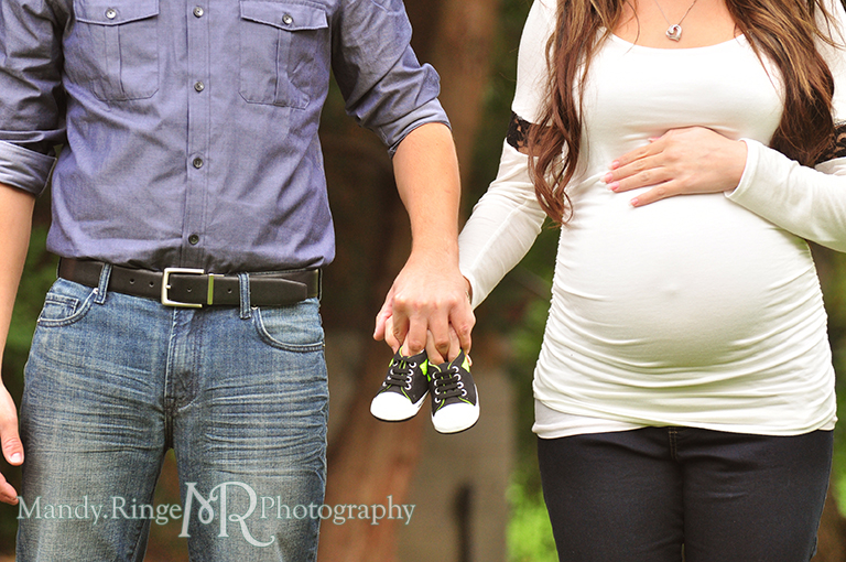 Man and woman holding baby shoes // Maternity portraits // Hurley Gardens - Wheaton, IL // by Mandy Ringe Photography