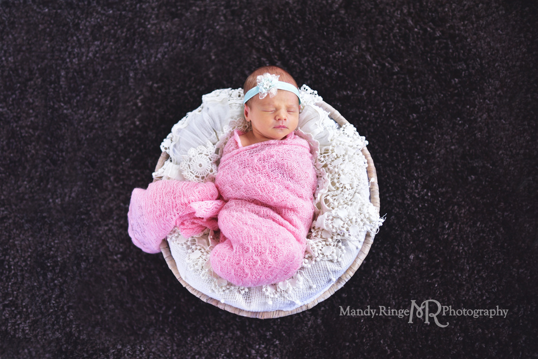 Newborn girl portraits // pink wrap, aqua, teal, mint headband, black rug, round basket, vintage lace stuffer // client's home - Geneva, IL // by Mandy Ringe Photography