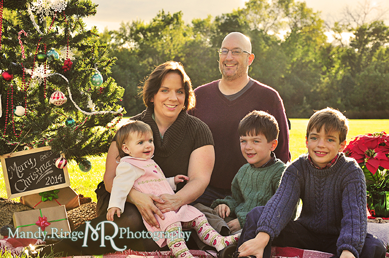 Outdoor family photo sitting on a blanket with a Christmas tree // Christmas mini session // Delnor Woods - St Charles, IL // by Mandy Ringe Photography