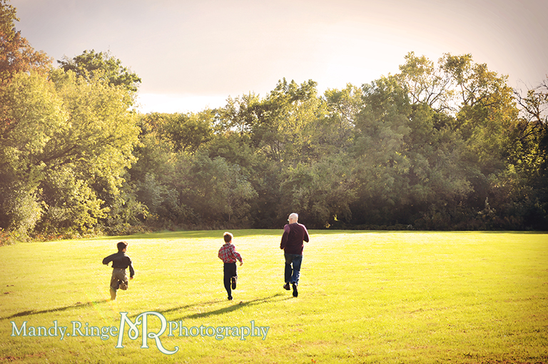 Outdoor family photo - dad running with the boys // Christmas mini session // Delnor Woods - St Charles, IL // by Mandy Ringe Photography