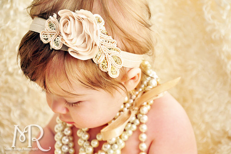 6 month old portrait with pearls and ivory flower headband // by Mandy Ringe Photography