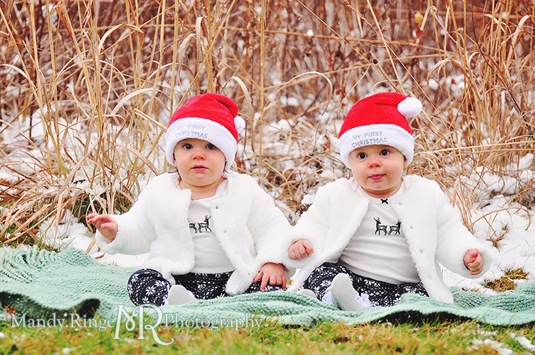 Outdoor winter family photo with twins wearing Santa hats sitting on a blanket // Baby's first Christmas // Ferson Creek Fen - St Charles, IL // by Mandy Ringe Photography