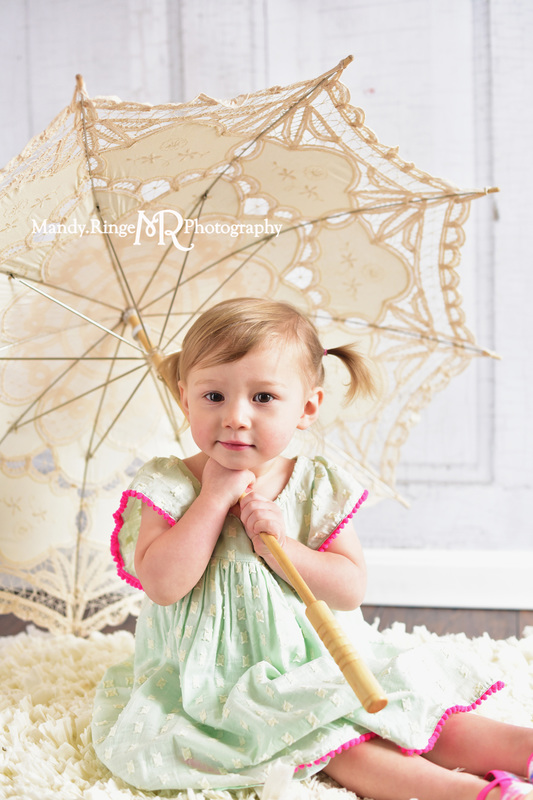 Toddler girl's second birthday portraits // Mint and hot pink, ivory rag rug, vintage lace parasol, two years old // client home - traveling studio // by Mandy Ringe Photography
