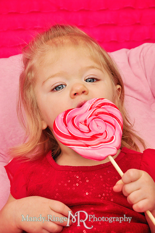 Valentine's Day candy and sweets photoshoot // Pink, fuchsia, red, white // White crate, pink chair, white fur floordrop, pink ruffle backdrop, conversation hearts, cookies, cupcake, cotton candy, lolliopop // by Mandy Ringe Photography