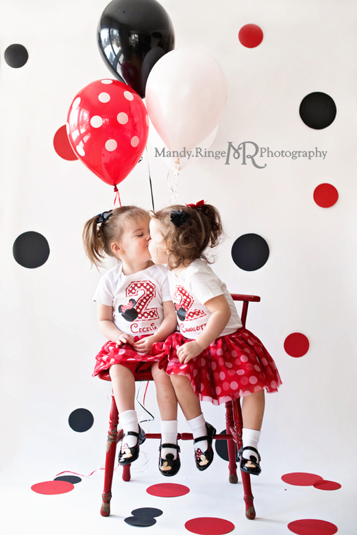 Twin girls' second birthday photo shoot // Minnie Mouse, balloons, white backdrop, red and black polkadots, red chair, mouse ears // Client's home - Winfield, IL // by Mandy Ringe Photography