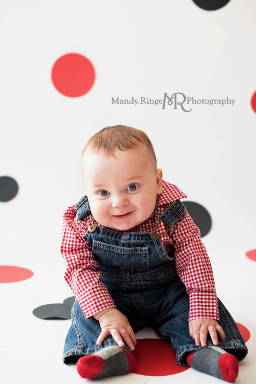 Twin girls' second birthday photo shoot // Minnie Mouse, balloons, white backdrop, red and black polkadots, red chair, mouse ears // Client's home - Winfield, IL // by Mandy Ringe Photography