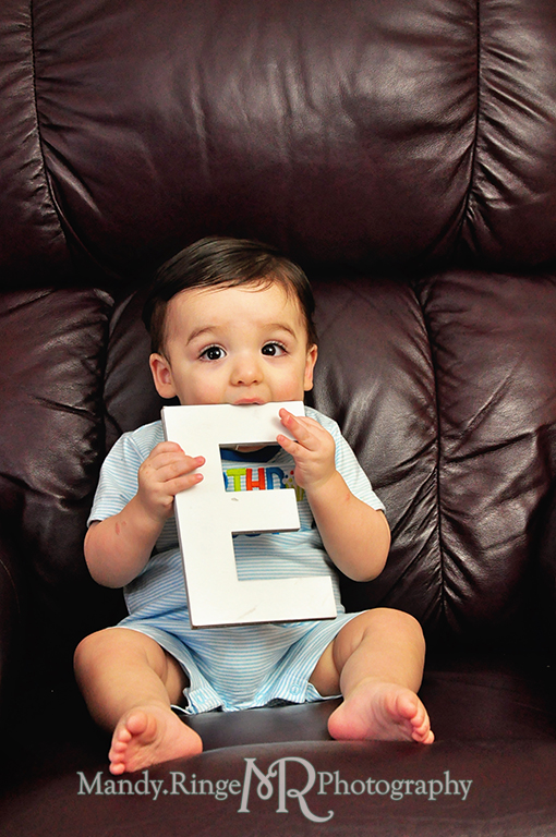 Boy's first birthday photo shoot // Holding letters to spell out ONE // by Mandy Ringe Photography