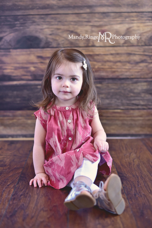 Girl's 2nd birthday portraits // Dark brown wood backdrop, client's home, travelling studio // St. Charles, IL // by Mandy Ringe Photography