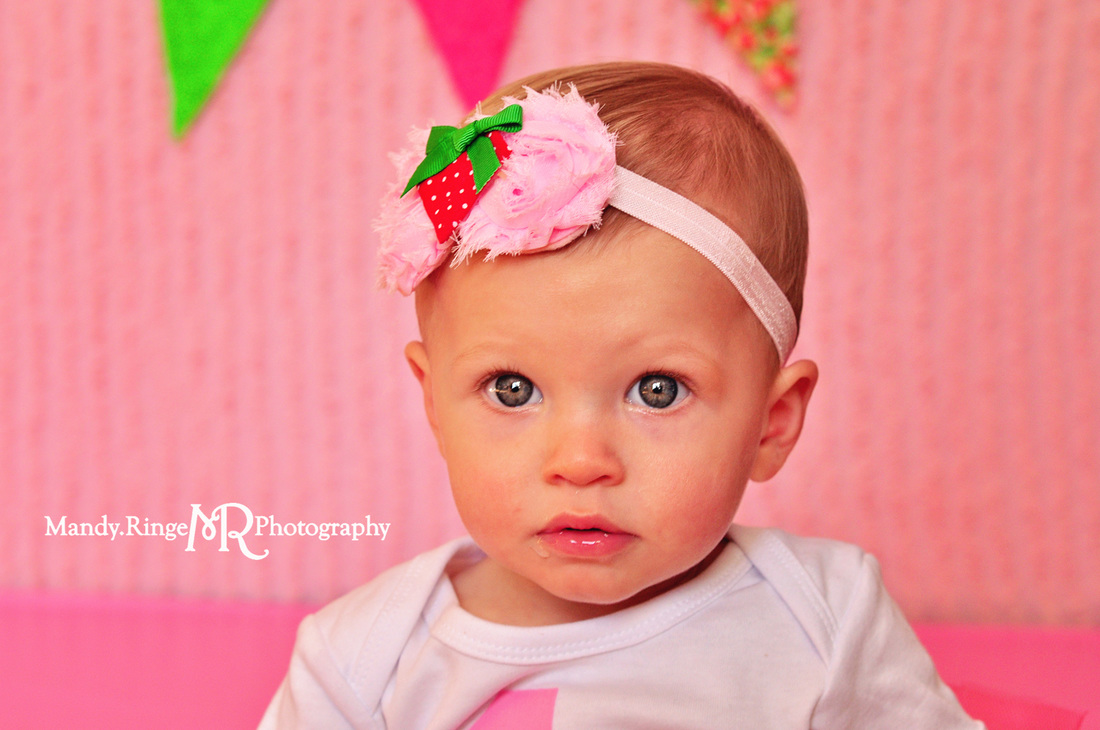 Girl first birthday portraits // Strawberry themed, pink ruffle backdrop, pennant banner, tutu // by Mandy Ringe Photography