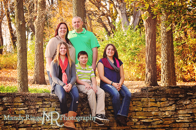 Autumn family portraits - Sitting on a stone wall // Fabyan Forest Preserve - Batavia, IL // by Mandy Ringe Photography