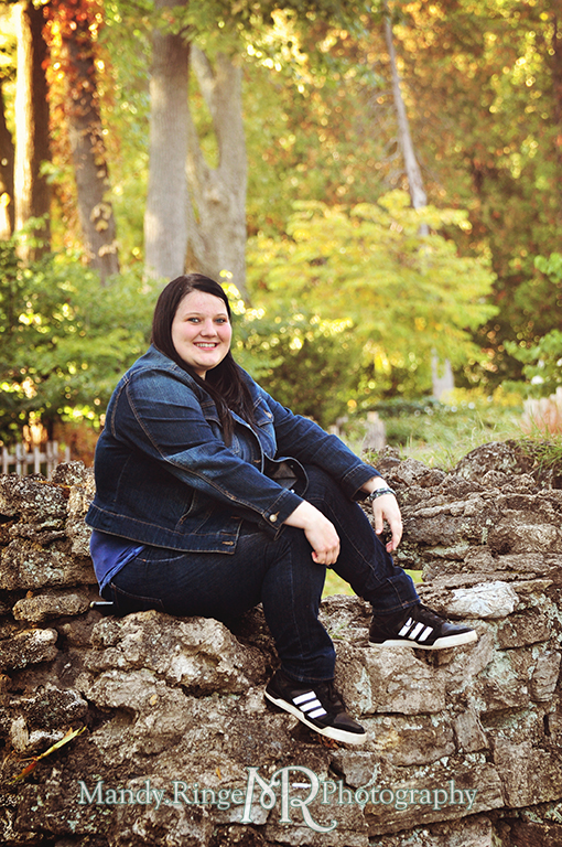 Teen girl sitting on a rock wall // Senior Photos // Fabyan Forest Preserve - Batavia, IL // by Mandy Ringe Photography