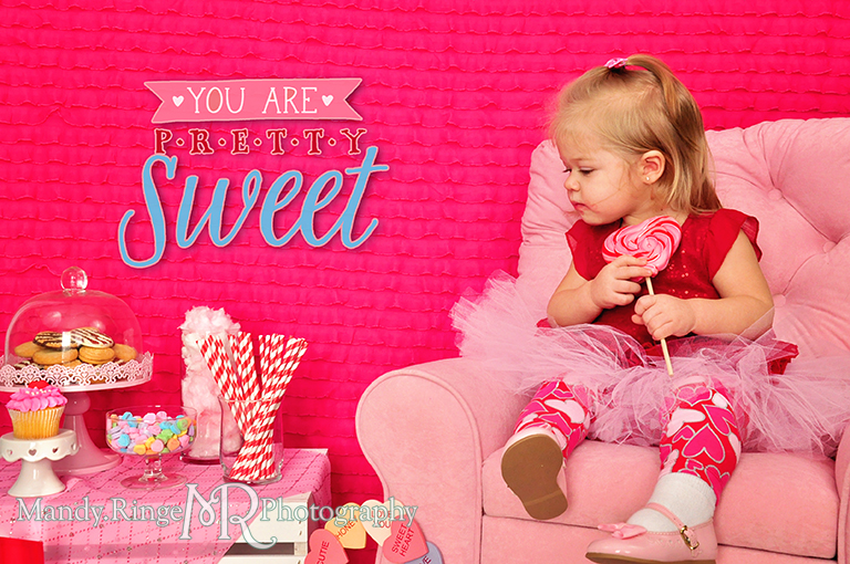 Valentine's Day candy and sweets photoshoot // Pink, fuchsia, red, white // White crate, pink chair, white fur floordrop, pink ruffle backdrop, conversation hearts, cookies, cupcake, cotton candy, lolliopop // by Mandy Ringe Photography