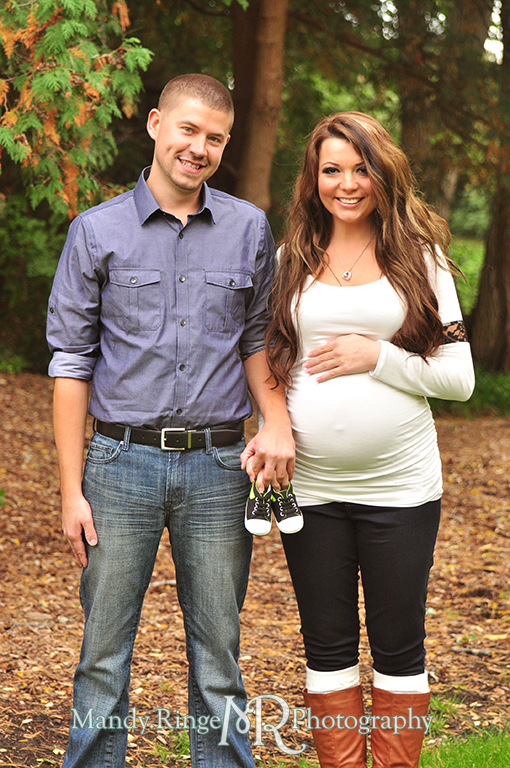 Man and woman holding baby shoes // Maternity portraits // Hurley Gardens - Wheaton, IL // by Mandy Ringe Photography