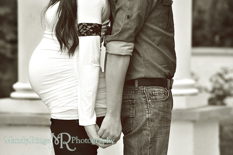 Belly shot of a pMan and pregnant woman standing back to back holding hands // Maternity portraits // Hurley Gardens - Wheaton, IL // by Mandy Ringe Photography