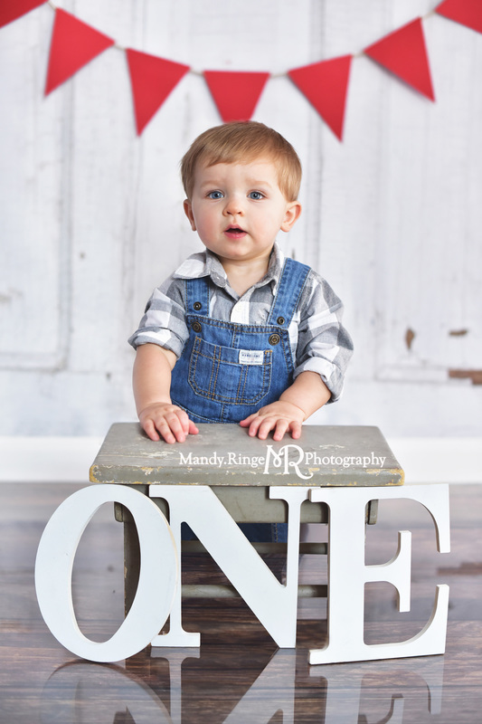 Boy's first birthday portraits // Red, gray, blue, overalls, shabby gray stool, ONE letters, pennant banner, vintage inspired // Traveling studio session at client's home - South Elgin, IL // by Mandy Ringe Photography