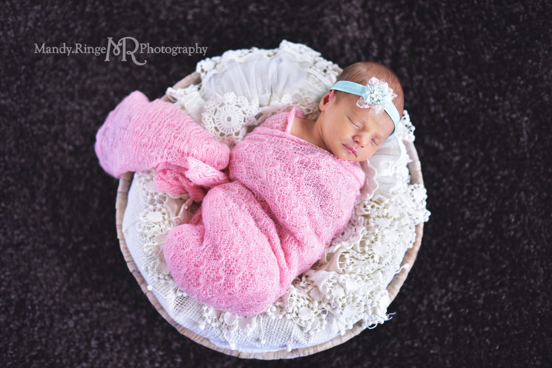 Newborn girl portraits // pink wrap, aqua, teal, mint headband, black rug, round basket, vintage lace stuffer // client's home - Geneva, IL // by Mandy Ringe Photography