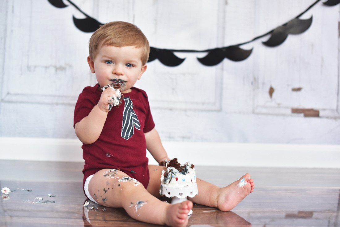 Boy's first birthday smash cake session // Little Gentleman, gray, blue, shabby gray stool, pennant banner, mustaches // Traveling studio session at client's home - South Elgin, IL // by Mandy Ringe Photography