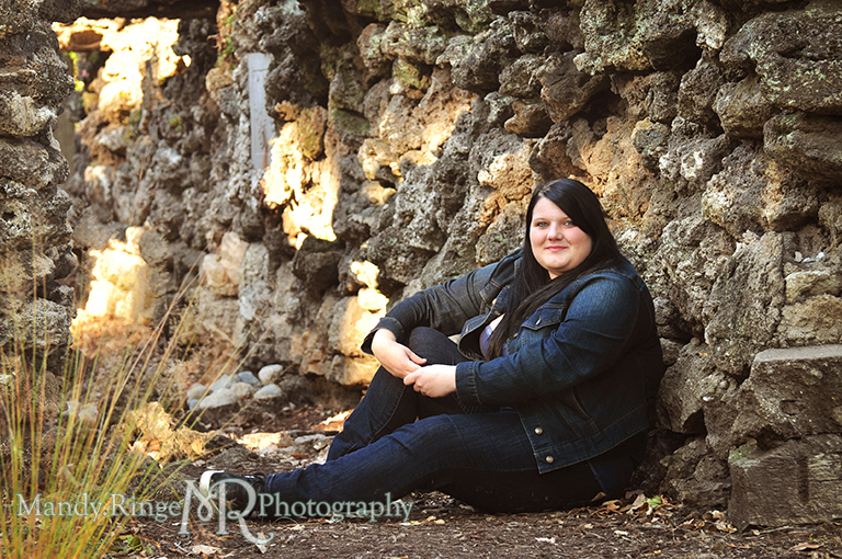 Teen girl sitting against a rock wall // Senior Photos // Fabyan Forest Preserve - Batavia, IL // by Mandy Ringe Photography