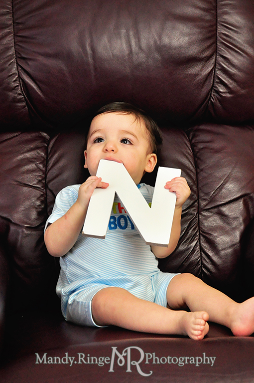 Boy's first birthday photo shoot // Holding letters to spell out ONE // by Mandy Ringe Photography