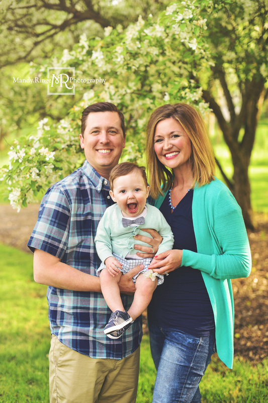Spring family portraits // family of three, cherry blossom tree, white flowers, teal and navy // Mount St. Mary Park - St. Charles, IL // by Mandy Ringe Photography