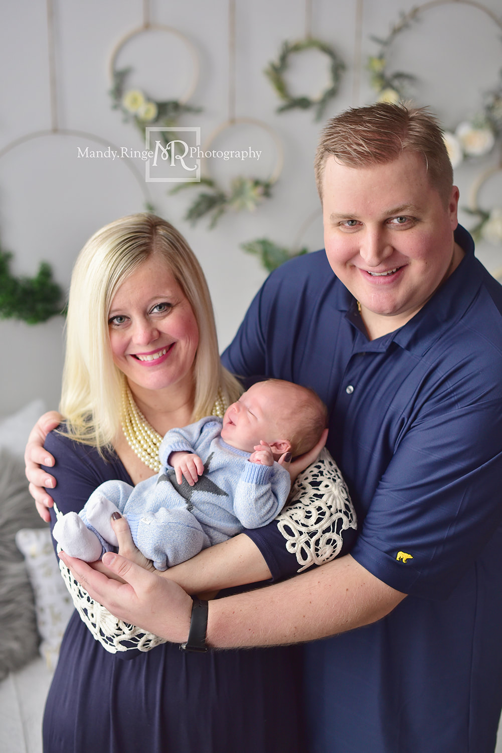 Newborn family portrait // baby boy, family of 3, floral hoop wall, blue // St. Charles, IL studio // by Mandy Ringe Photography