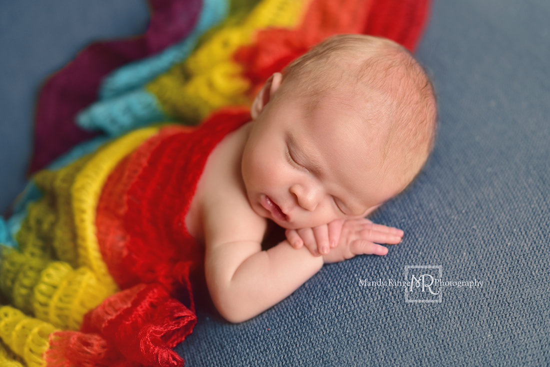 Newborn boy portraits // Rainbow baby, knit scarf, head on hands pose, blue blanket // St. Charles, IL studio // by Mandy Ringe Photography
