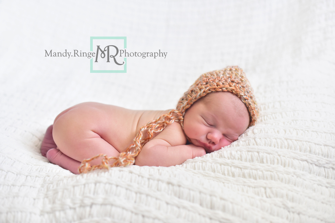 Newborn boy portraits // nude, white knit blanket, orange crochet hat // Client's home - travelling studio - Geneva, IL // Mandy Ringe Photography