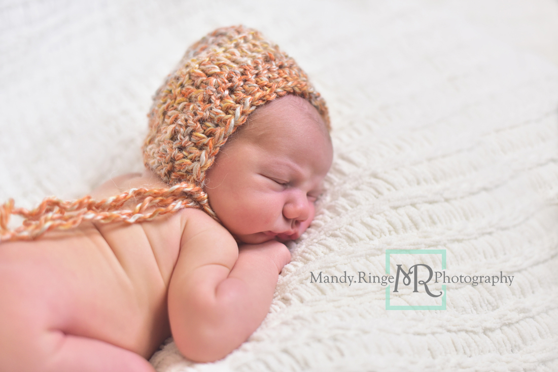 Newborn boy portraits // nude, white knit blanket, orange crochet hat // Client's home - travelling studio - Geneva, IL // Mandy Ringe Photography